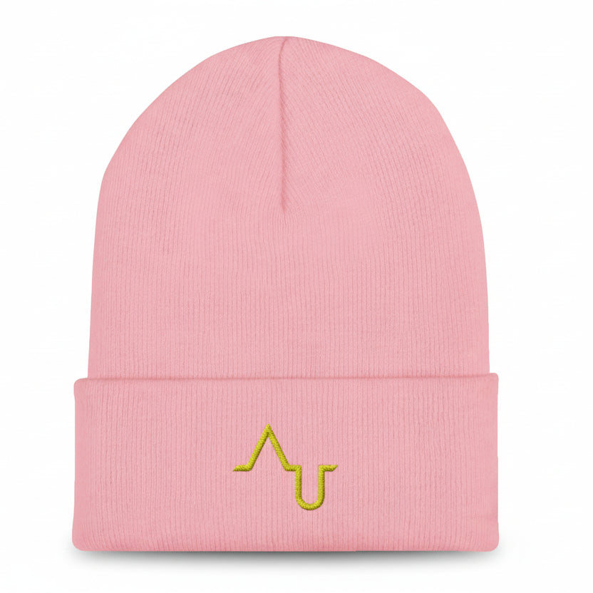 Pink beanie with a yellow logo on a black background