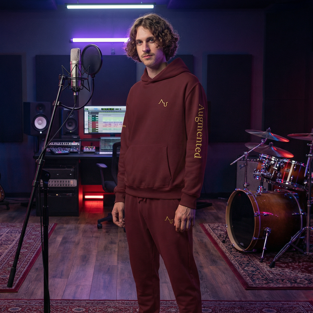 Person in a music studio with musical instruments and equipment.