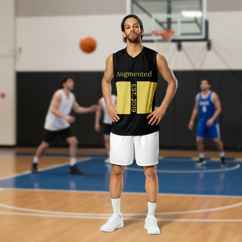 Man in a black and yellow basketball jersey standing on a court with other players in the background.